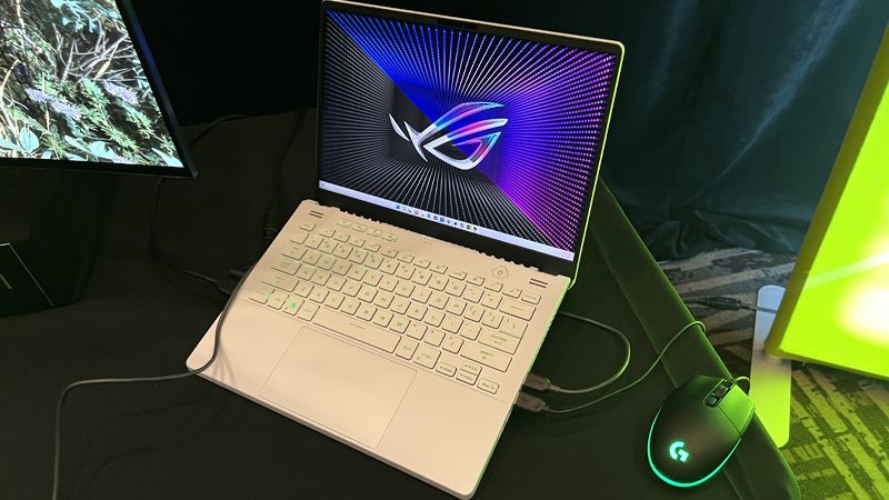 An Asus ROG Zephyrus G14 on a black cloth covered table