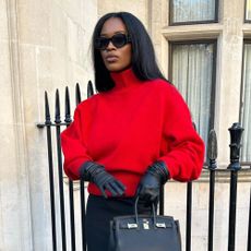 Influencer wears a funnel neck jumper.