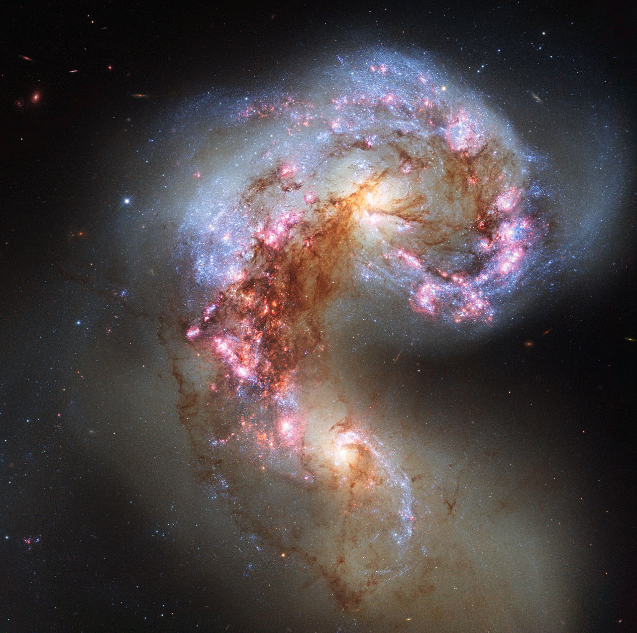 A photo showing two galaxies appearing to interact in space