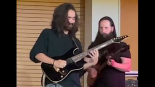 Mateus Asato and John Petrucci jamming on stage