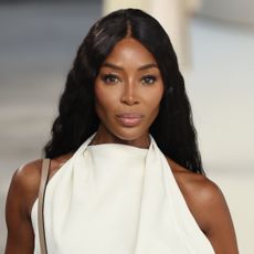 Naomi Campbell is spotted in Paris wearing a denim Adidas tracksuit and chunky sneakers