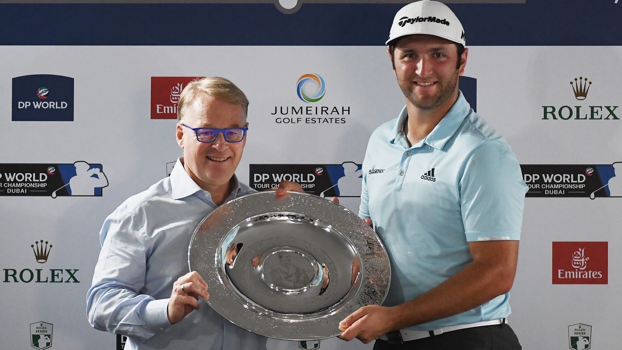 Keith Pelley hands Jon Rahm the Sir Henry Cotton Rookie of the Year award in 2017