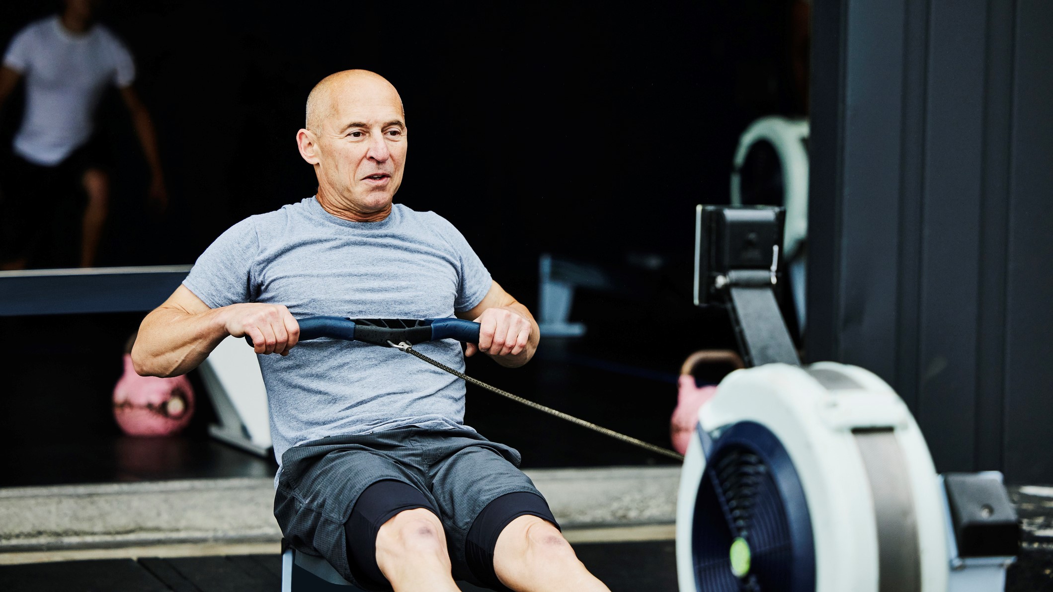 person using rowing machine