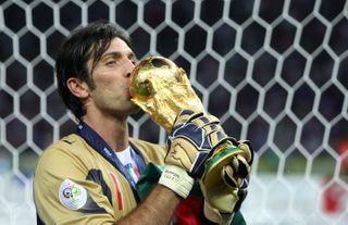Italy goalkeeper Gianluigi Buffon kisses the World Cup trophy in 2006.
