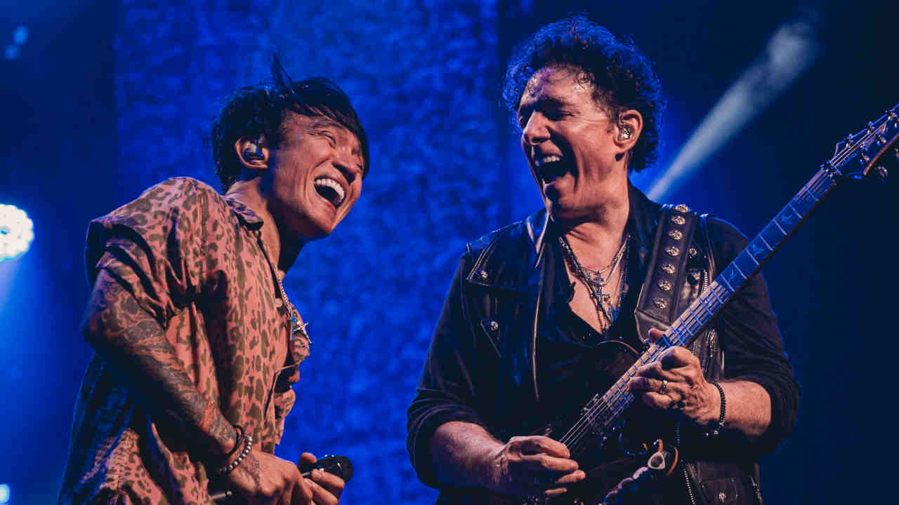 Journey’s Arnel Pineda and Neal Schon performing onstage in 2023
