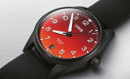 Oris watch with orange dial