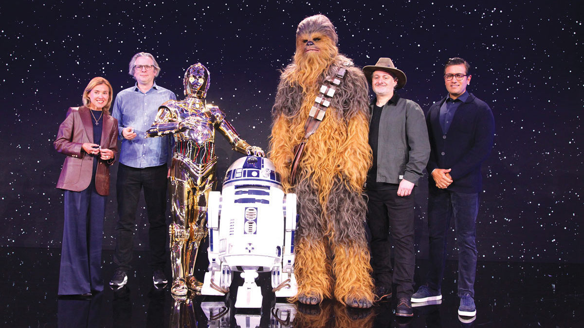 Chewbacca, C-3PO, R2-D2 join Dave Filoni and others on stage at CES to introduce the new LEGO Smart Brick. 