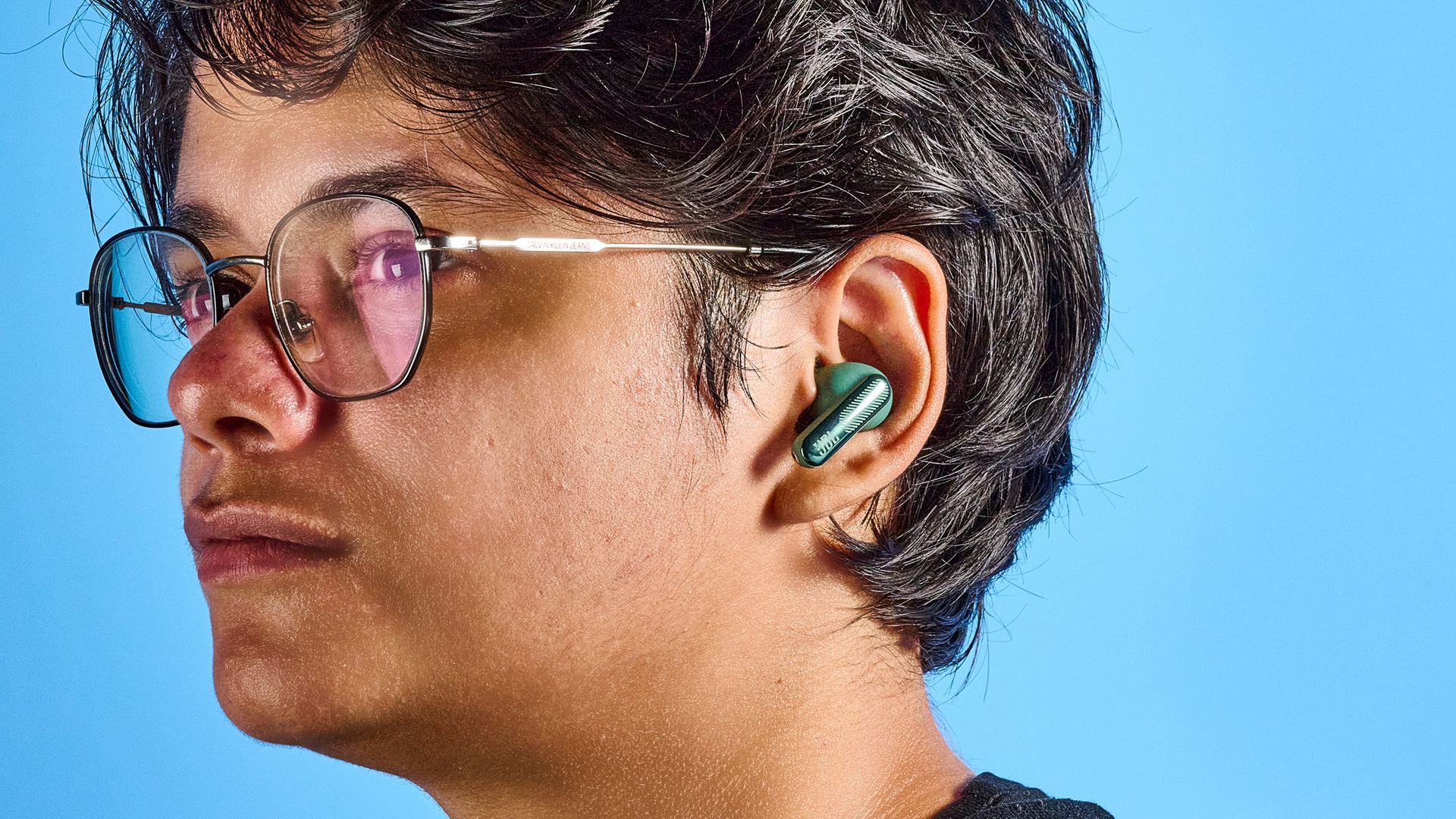JBL Live Beam 4 earbuds in a person's ears