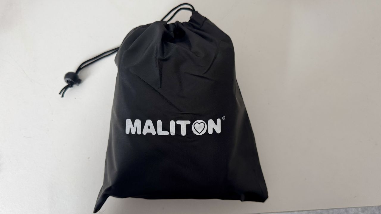The Maliton inflatable travel pillow packaged and inflated