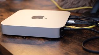 Apple Mac Mini on wood desk