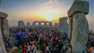 People gather for sunrise at Stonehenge, on June 21, 2022 in Wiltshire, England. 