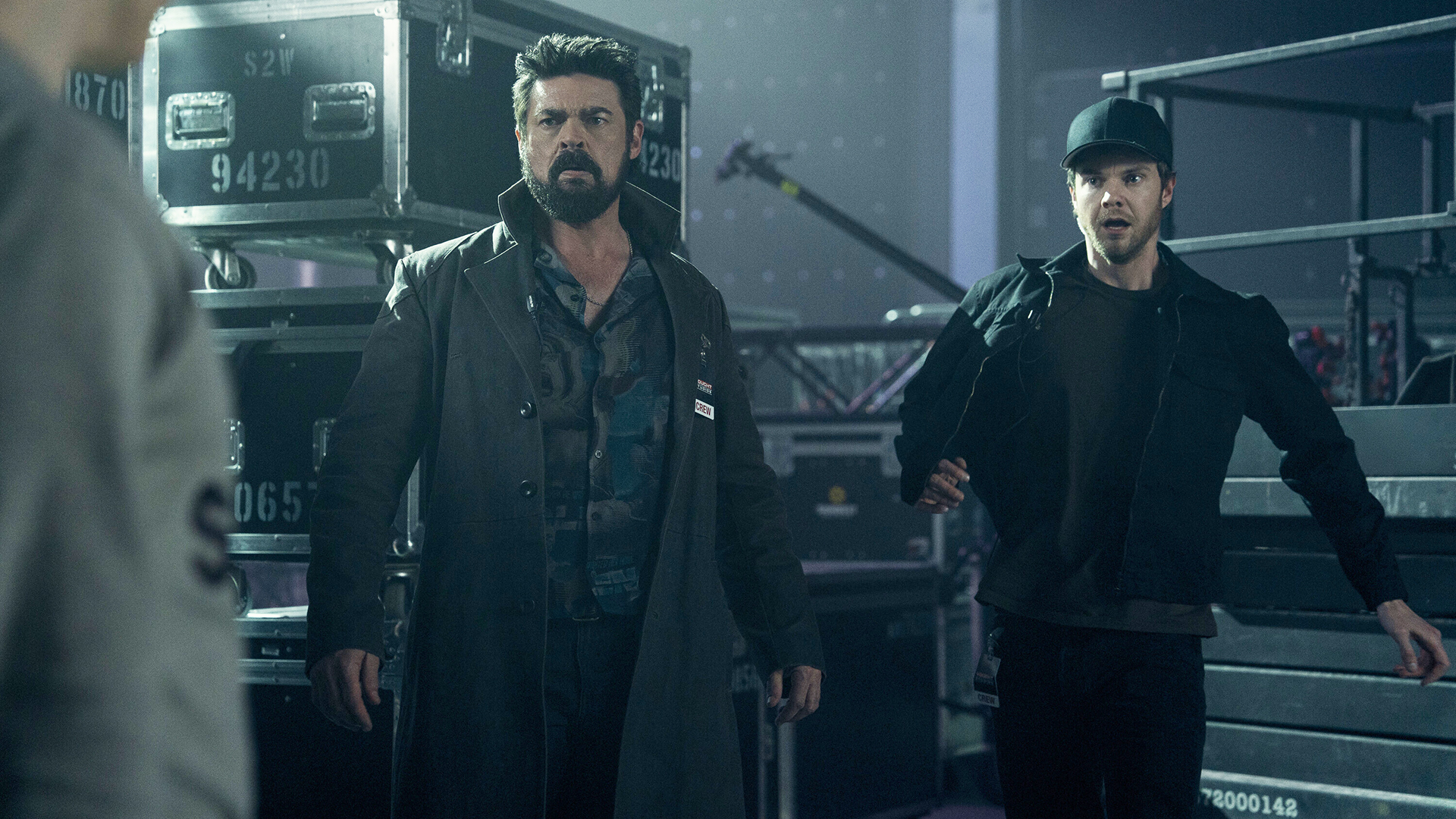 Billy and Hughie looking shocked at someone off-camera in The Boys season 5 episode 7