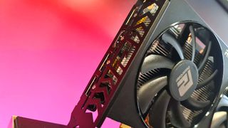 AMD Radeon RX 6600 graphics card on colourful background.