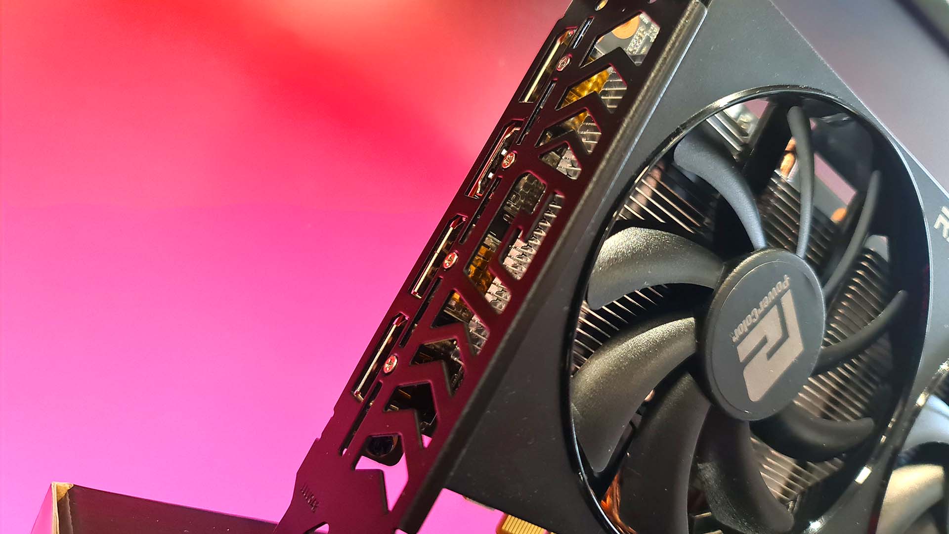 AMD Radeon RX 6600 graphics card on colored background.