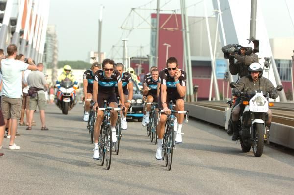 Bradley Wiggins (right) is the centre of attention as Team Sky pass over the Erasmus bridge