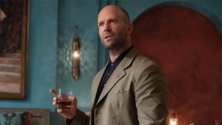 Jason Statham stands in a suit in a still from the movie Operation Fortune: Ruse de Guerre, one of the best new Prime Video movies you can watch now