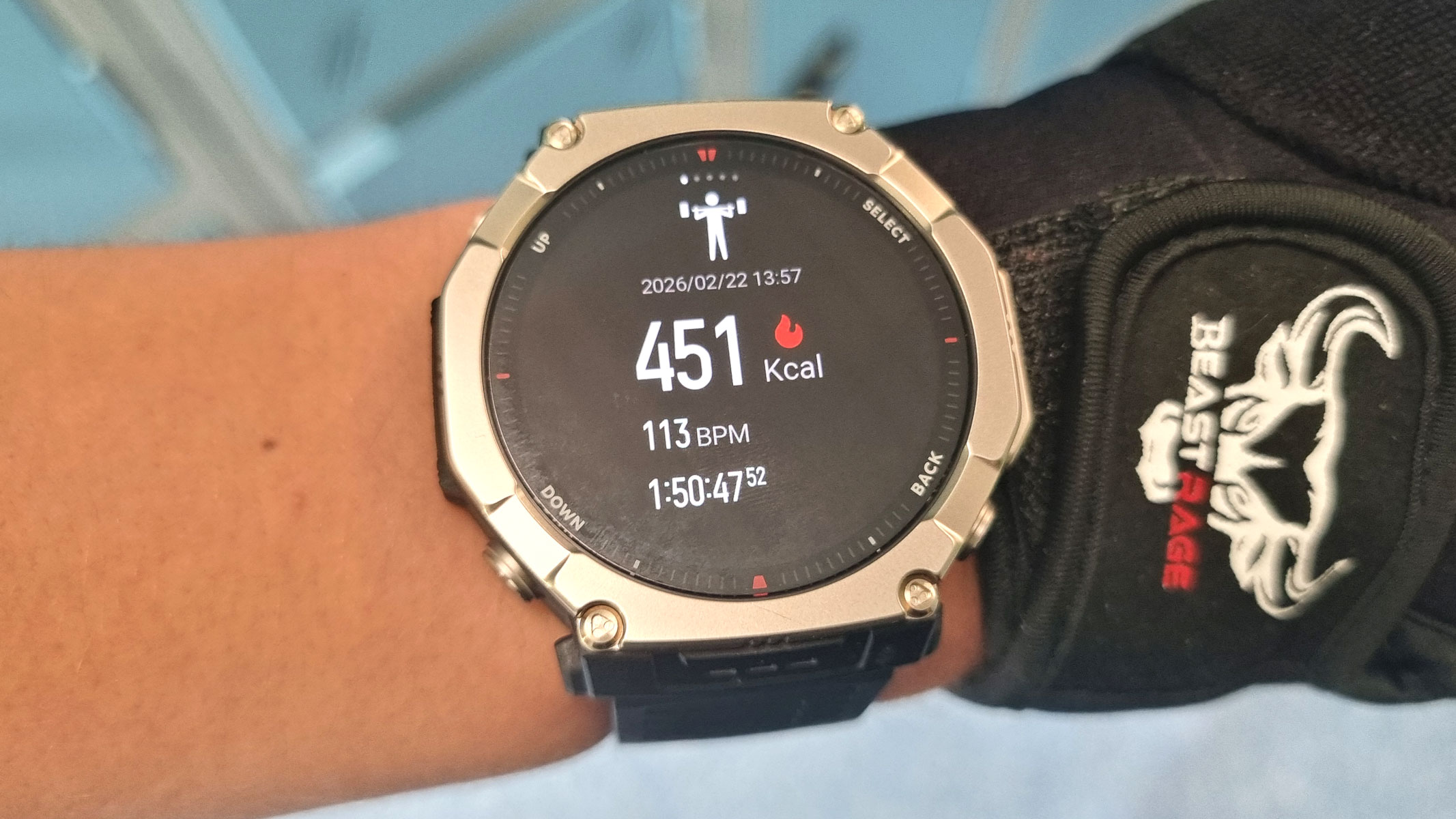 a close-up picture of our reviewer testing the Amazfit T-Rex Ultra 2 smartwatch in the gym
