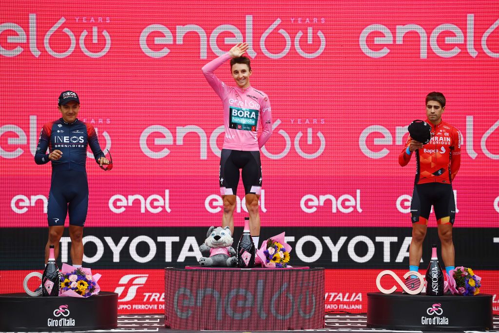 VERONA ITALY MAY 29 LR Richard Carapaz of Ecuador and Team INEOS Grenadiers on second place race winner Jai Hindley of Australia and Team Bora Hansgrohe Pink Leader Jersey and on third place Mikel Landa Meana of Spain and Team Bahrain Victorious pose on the podium ceremony after the105th Giro dItalia 2022 Stage 21 a 174km individual time trial stage from Verona to Verona ITT Giro WorldTour on May 29 2022 in Verona Italy Photo by Tim de WaeleGetty Images