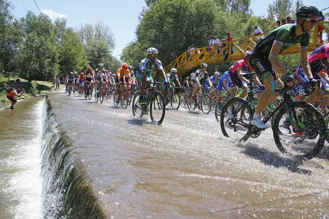 Riders cross a stream on stage 2 of the Tour de San Luis