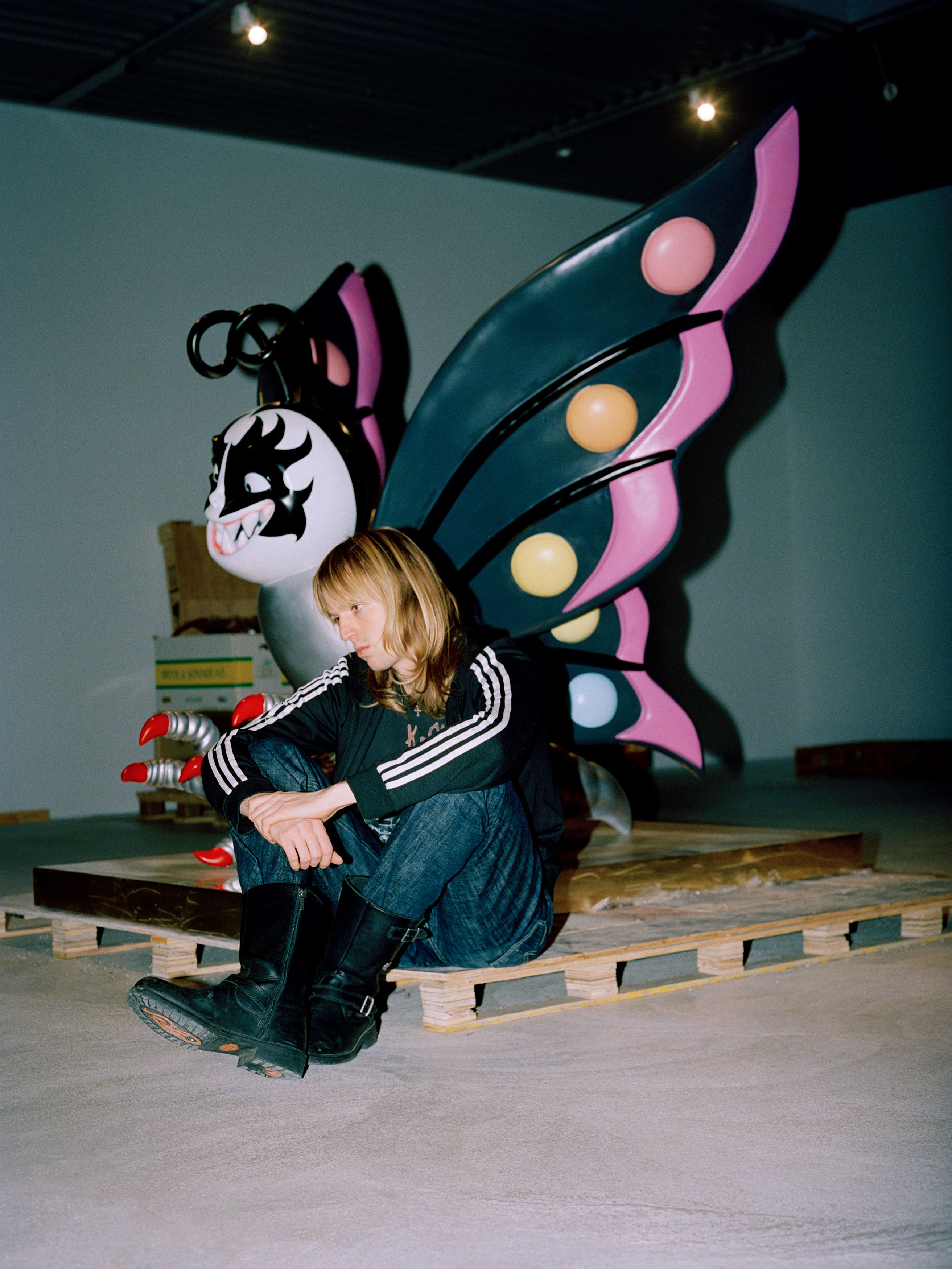 Artist Esben Weile Kjær with butterfly artwork