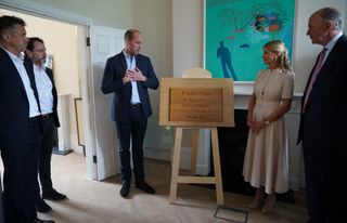 Prince William, Duke of Cambridge unveils a plaque during a visit to the new London centre of James' Place