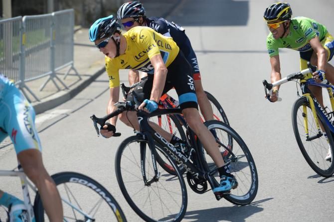 Chris Froome (Team Sky) takes a late corner with Contador on his wheel
