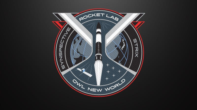 A circular mission patch with a black and white rocket launching through the middle.