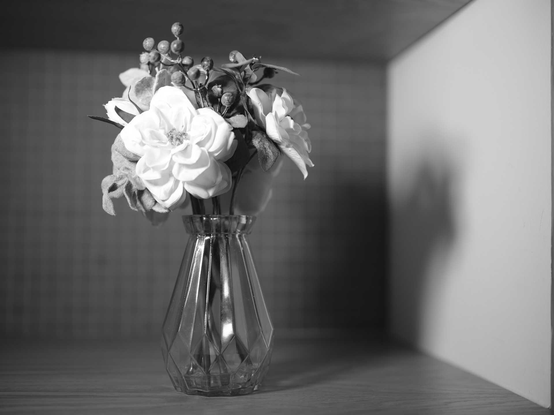 Flowers on a wooden table with black and white Fujifilm film simulation