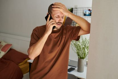 A man complains over the phone (image: Getty Images)