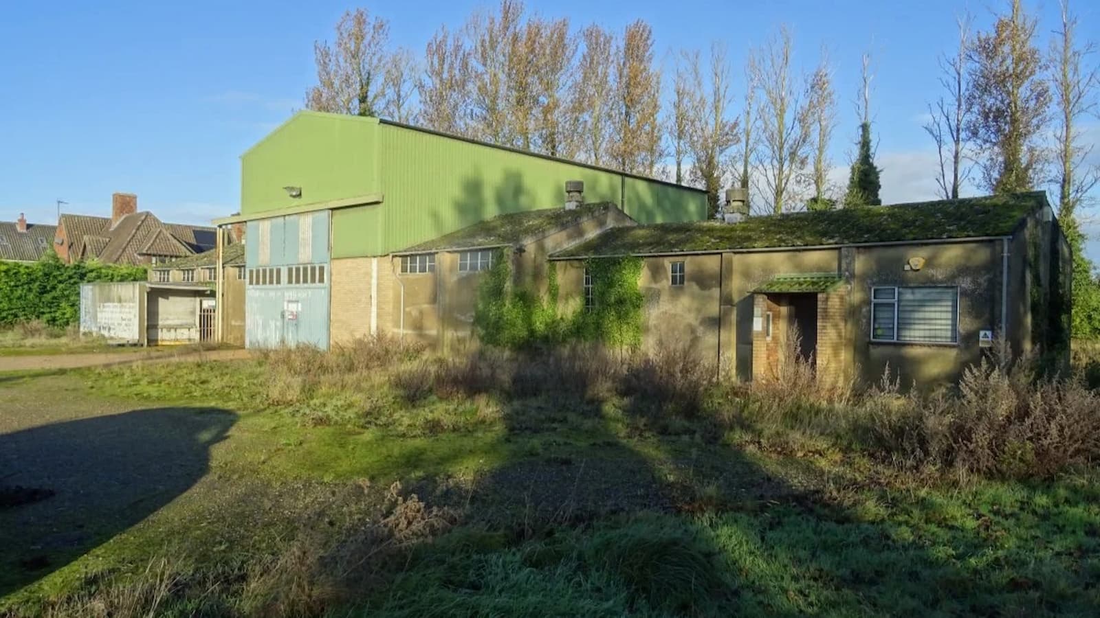 A plot with a barn on it for a self-build plot