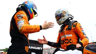 Pole position qualifier Lando Norris of Great Britain and McLaren and Second placed qualifier Oscar Piastri of Australia and McLaren celebrate in parc ferme during qualifying ahead of the F1 Grand Prix of Hungary at Hungaroring on July 20, 2024 in Budapest, Hungary. 