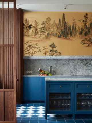 Blue kitchen with yellow ornate kitchen wallpaper