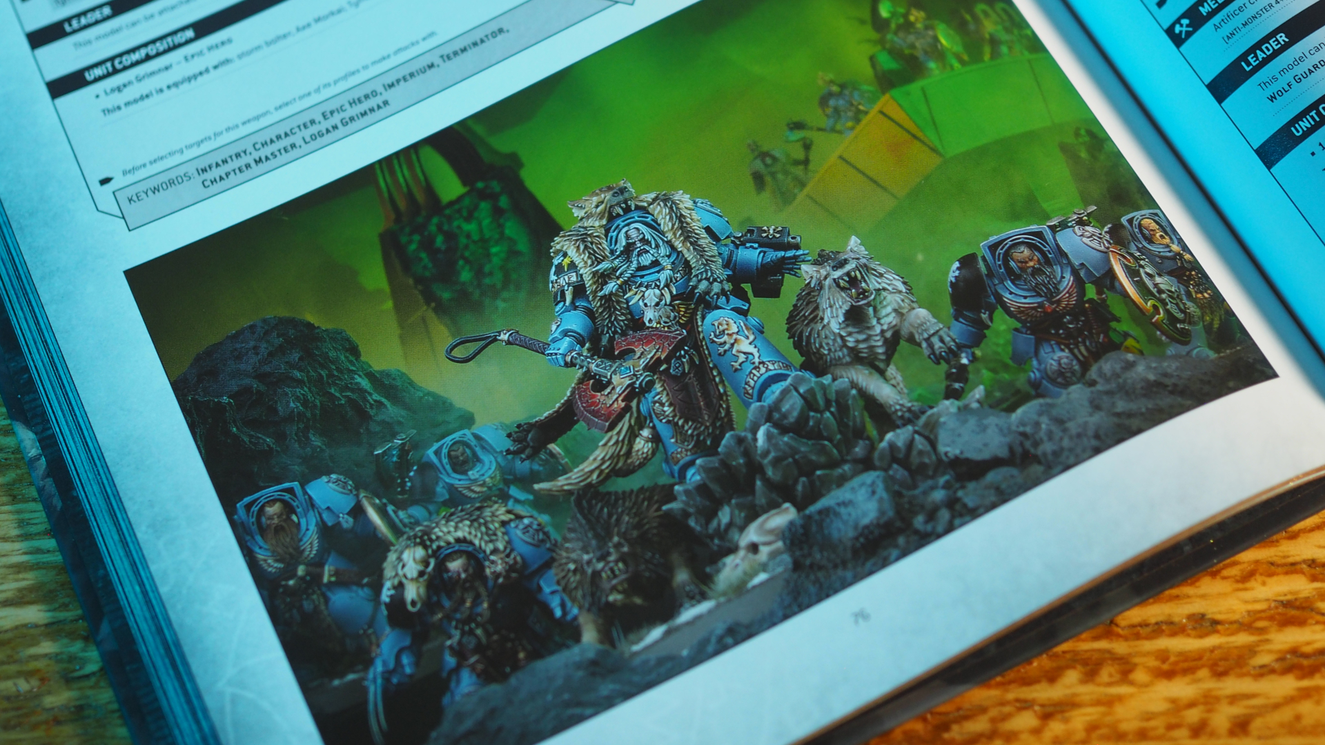 Space Wolves Codex open on an image of a hero with a pack of wolves