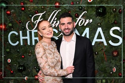 Lindsay Lohan (left) and her husband Bader Shammas (right) at the premiere for Falling for Christmas