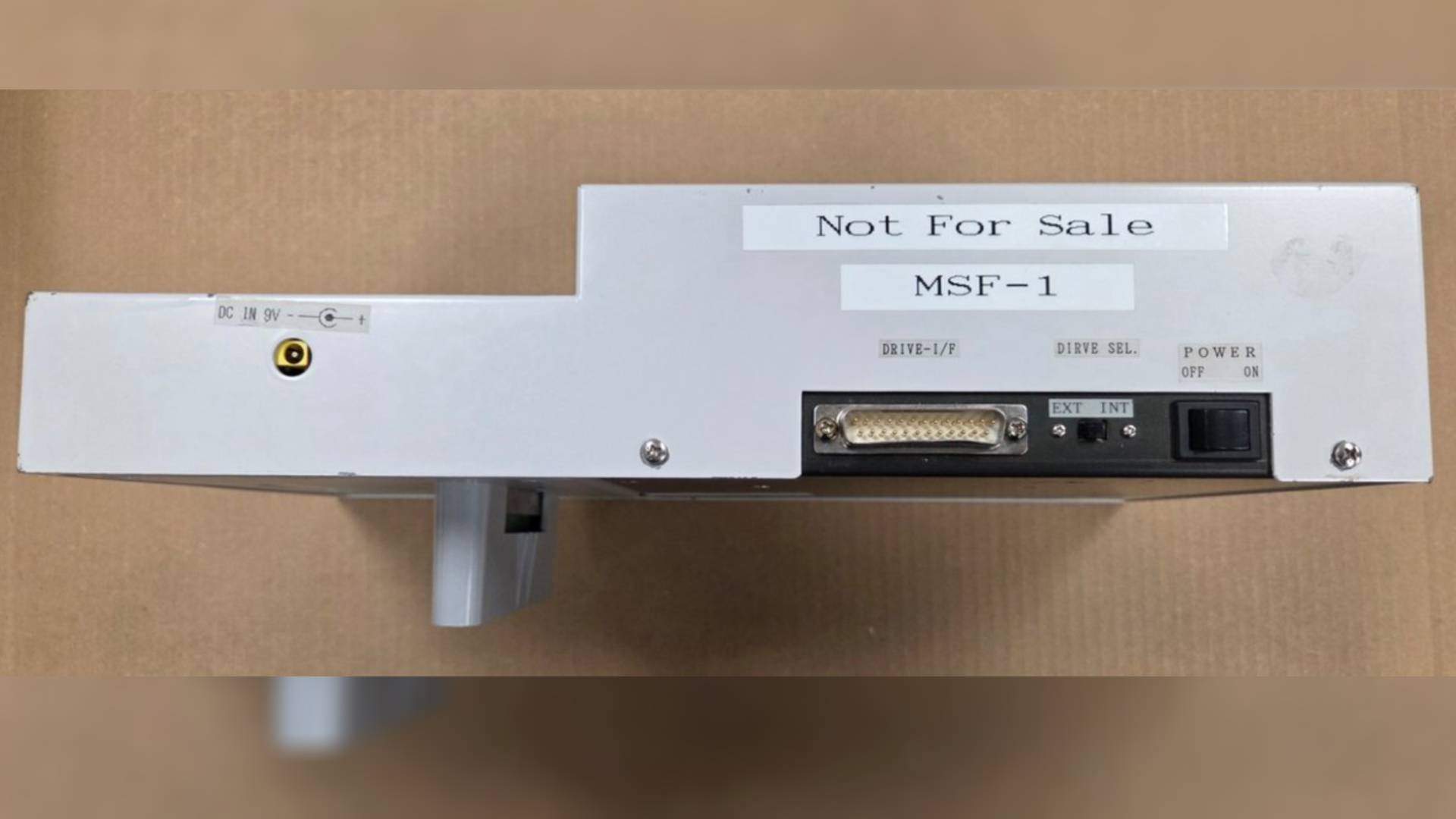 Side view of Nintendo PlayStation prototype with parallel port and power switch.