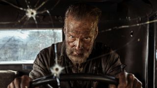 Aatami Korpi (Jorma Tommila) drives his truck in Sisu: Road to Revenge.