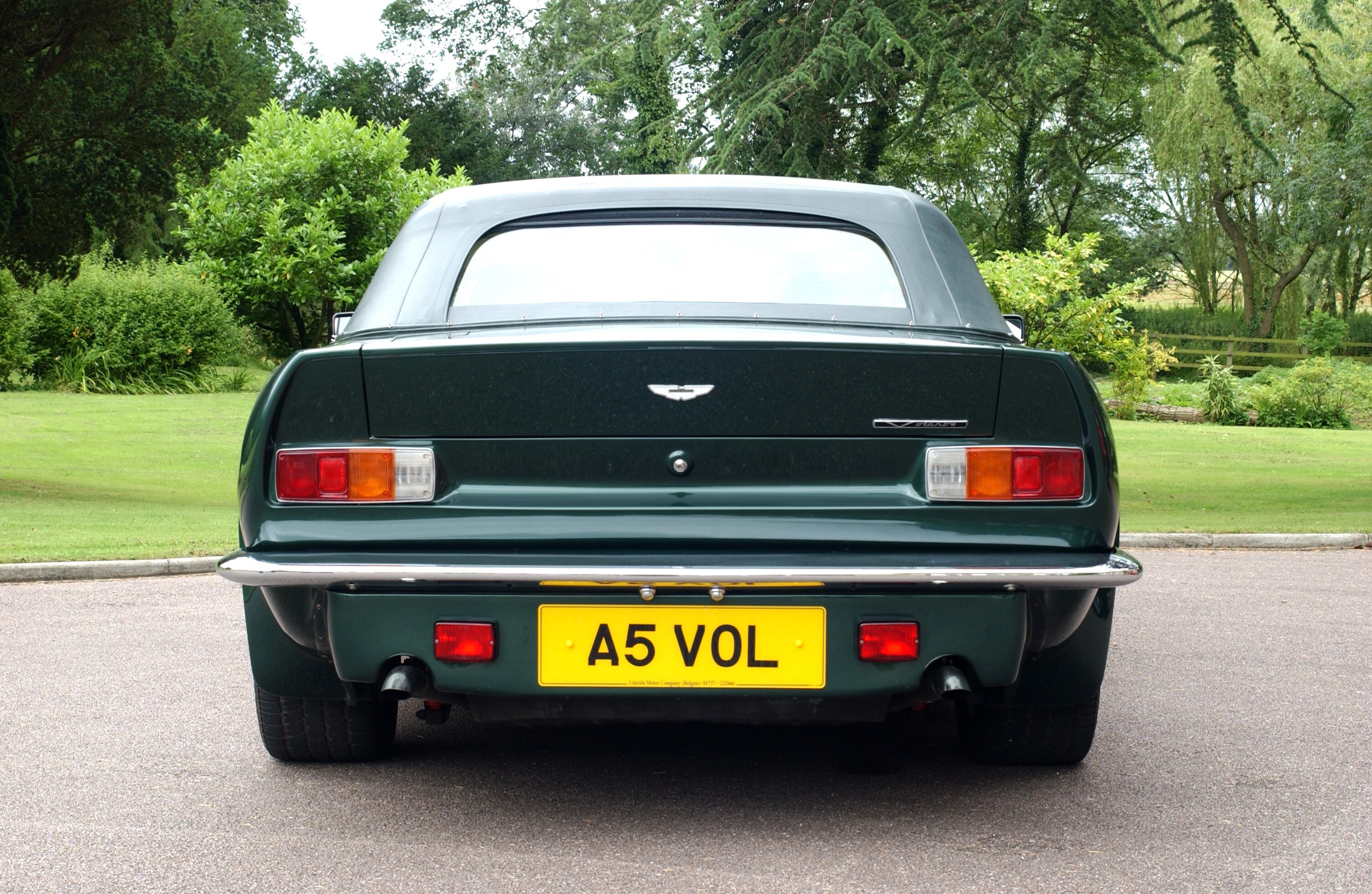 Details of the V8 Vantage Volante, showing the interiors, the engine and the front and rear of the car