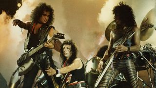 A make-up-free Kiss onstage at Wembley, 1983