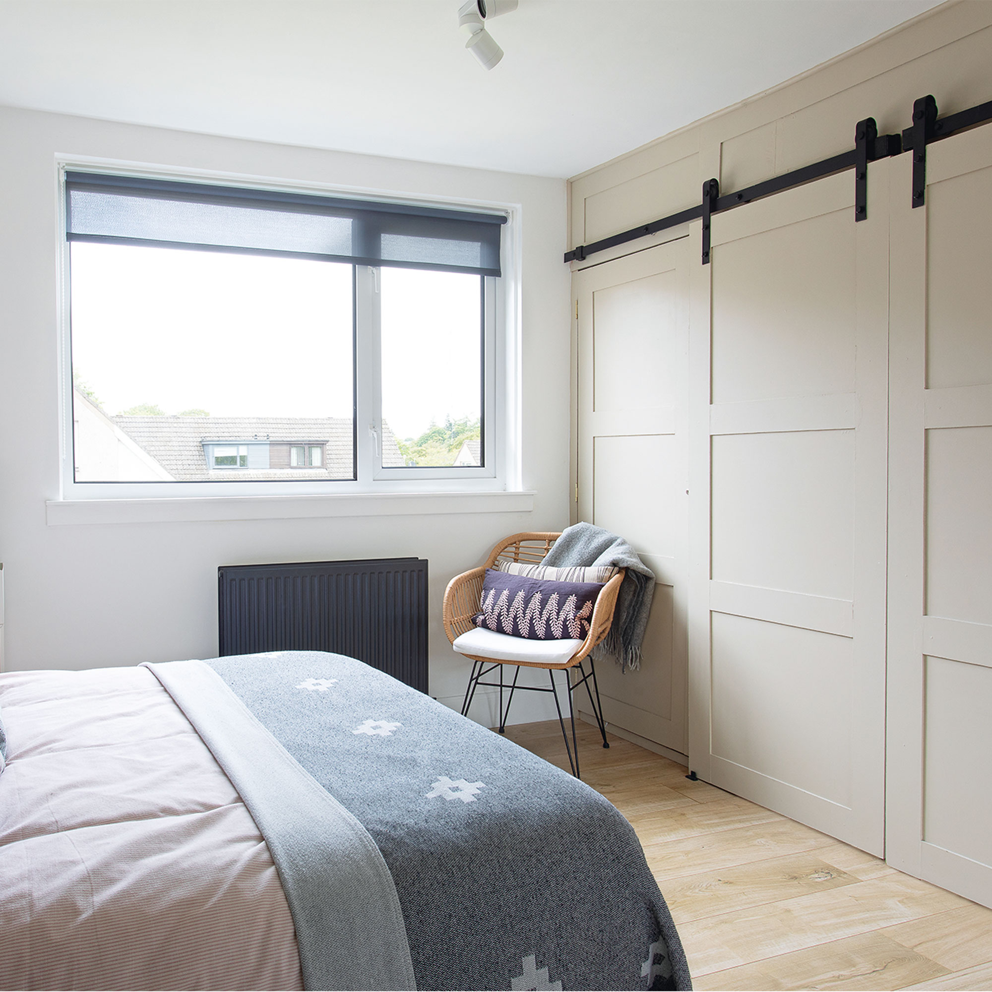 grey and white bedroom with wardrobe
