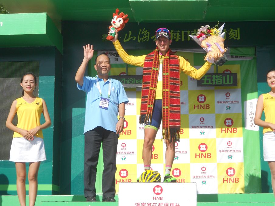 Sacha Modolo on the podium after defending his leader's yellow jersey