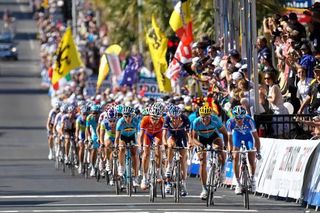 The bunch crosses the line with one lap to go in the elite men's road race at the world championships in Geelong.