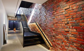 Stairwell next to brick wall
