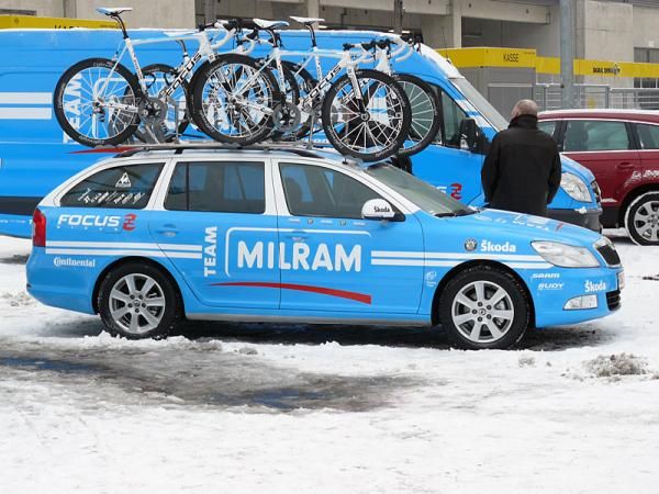 A Milram team car in the snow at Dortmund, Germany for the team launch.