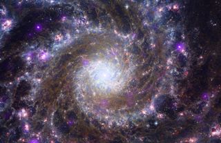 a white and blue spiral galaxy surrounded by stars