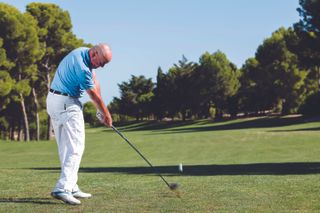 Keith Williams strikes a fairway wood