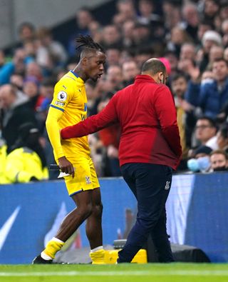 Crystal Palace’s Wilfried Zaha (left) reacts after being sent off at Tottenham