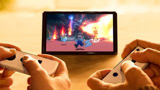 Best Nintendo Switch games : a shot of two people playing Mario on a Switch OLED
