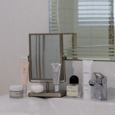 Beauty products on a bathroom sink