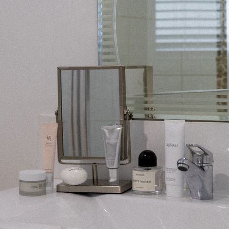 Beauty products on a bathroom sink