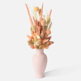 Urban Stems dried flowers in pink vase